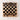 A photograph of a Flayou Chich Bich Chess set in black clay Birds Eye view.