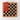 A photograph of a Flayou Chich Bich Chess set in black clay pizza box.