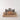 A photograph of a Flayou Chich Bich Chess set in black clay side view other side.