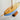 A photo of a blue wood Grove Pond free Sailing model sailboat looking at the deck