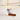 A photo of a white grove pond free sailing model sailboat with keel detail