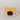 Yellow and black camera lens with 'F=173' and Racina branding on a gray background laying flat.