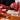 A photo of people playing the Lacorsa Grand Prix board game on a table