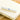 a photo of a white perfection ballpoint pen sitting on a notebook