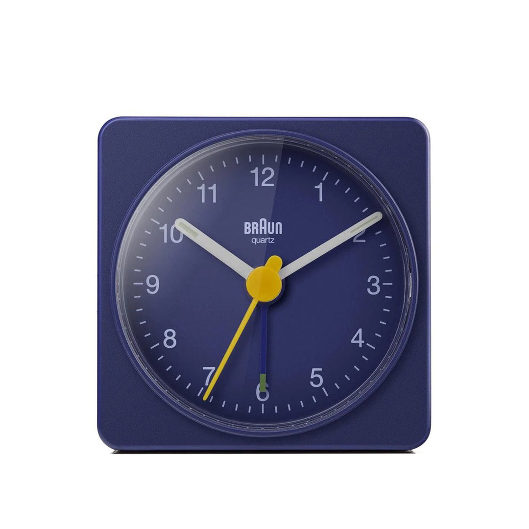 A Braun classic analog travel alarm clock BC02 in blue. Portable battery powered. 