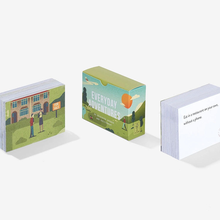 Three small boxes, showing the everyday adventure cards with illustrated covers on a white background
