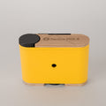 Racina yellow and wooden 120  pinhole  camera on a gray background