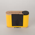 Racine 120 film Yellow and black camera on a gray background 